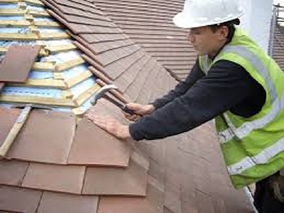 Repairing tiles to a roof in Cleveleys FY5